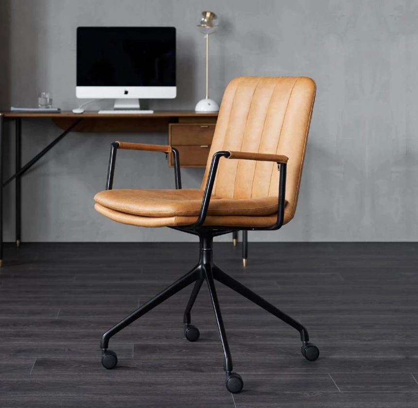 Beige leather office chair in office at home.